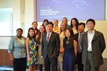 Dr. Li standing with group