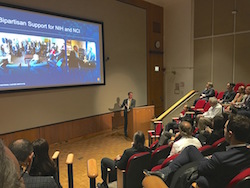 Dr. Sharpless giving a speech