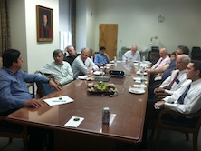 faculty standing together in conference room.