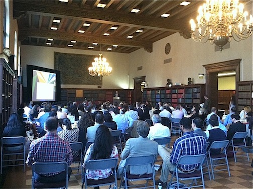 Students listening to a presentation in the library.