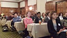 Audience watching presenters. 