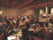 Audience watching presenters. 