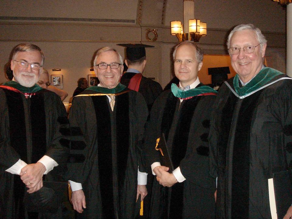 Alumni and professors in regalia. 