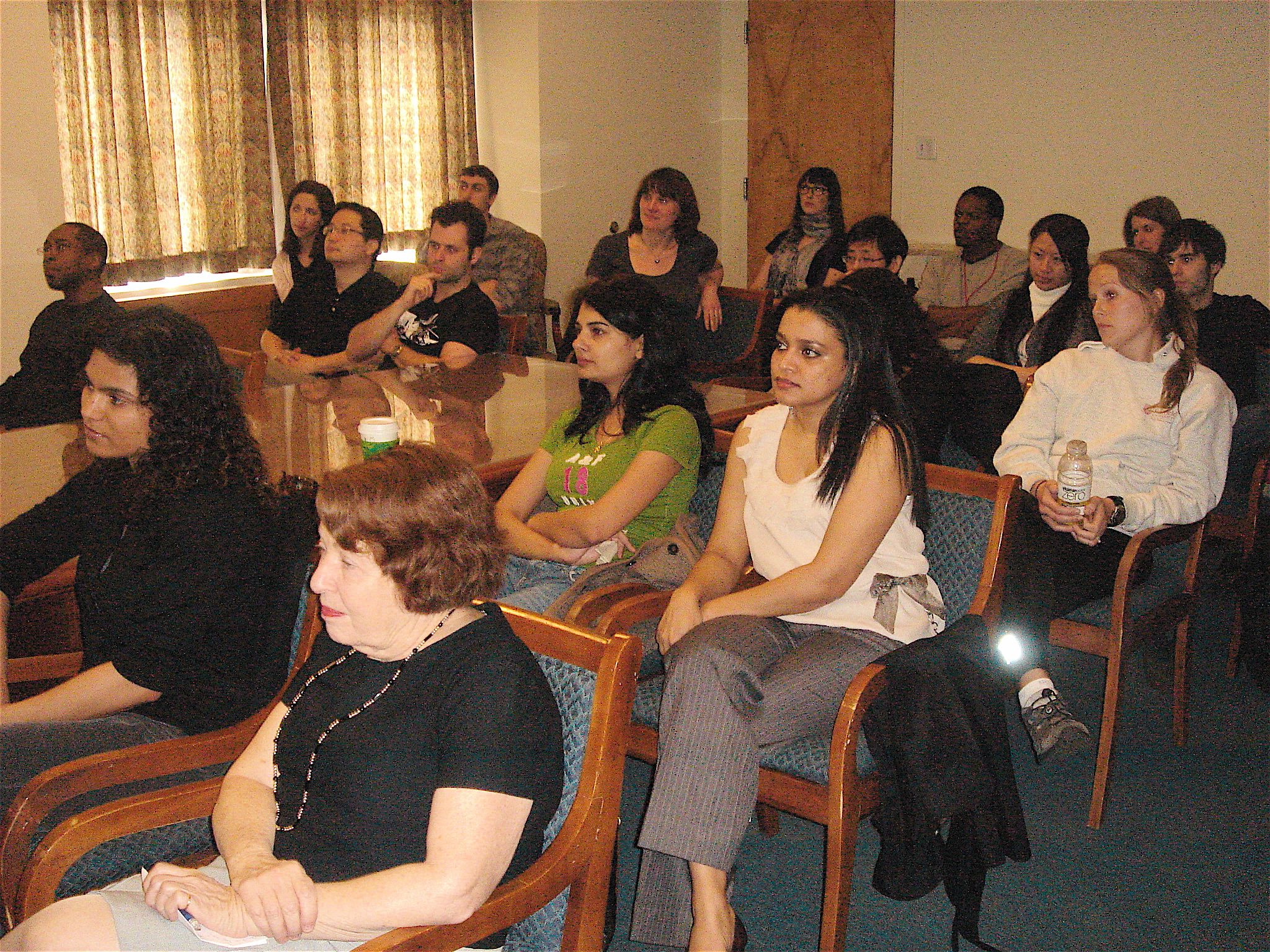 Other students, lab members, and friends listen to Vasundhra's research talk.