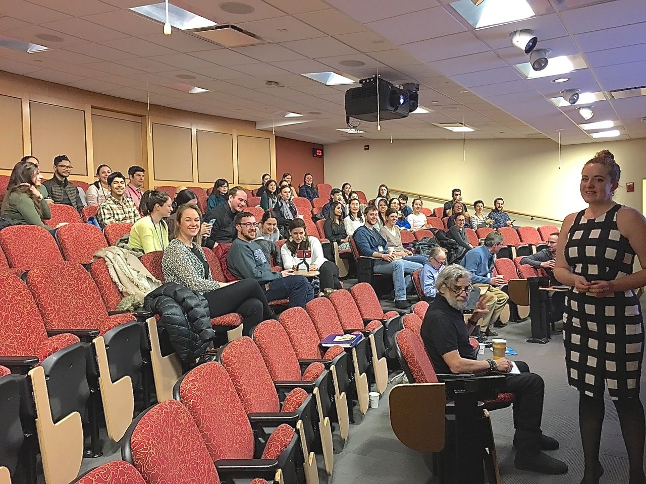 Students in auditorium for Mercer thesis defense.