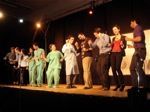 Pharmacologists dancing onstage.