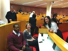 Colleagues sitting on bench.