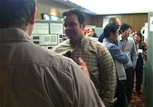 Researcher networking at event.