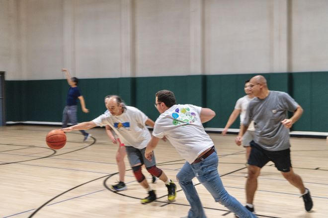 John Blenis, student Domenic Gargiulo and Omar Abdel-Wahab on the basketball court