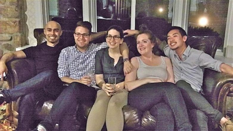 Students sitting together on a couch. Students sitting together on a couch.