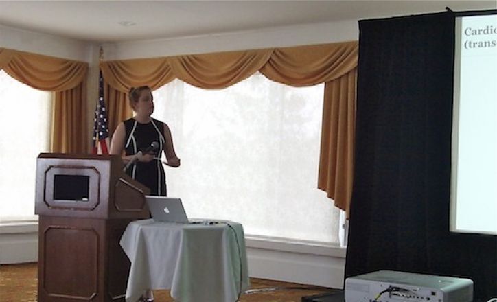 Presenter speaking at a podium. Presenter speaking at a podium.