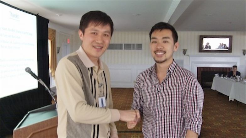 Students shaking hands in a hallway.