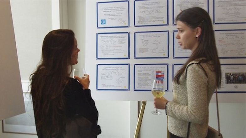 Students presenting a board presentation.