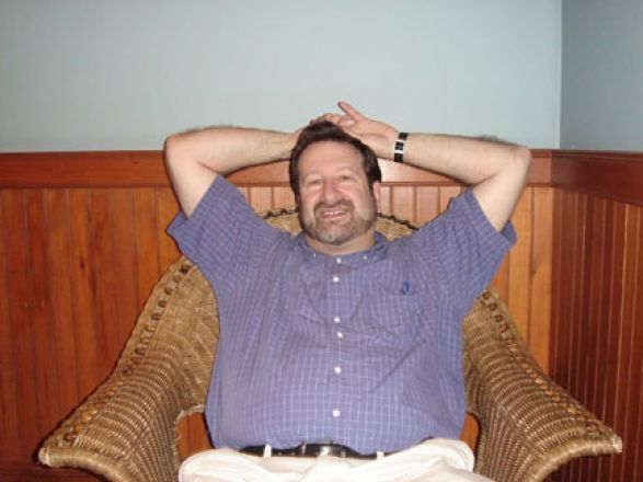 Student relaxing on a couch. Student relaxing on a couch.