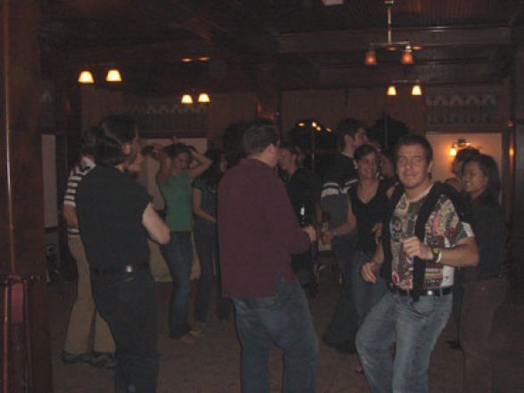 Students socializing at a party. Students socializing at a party.