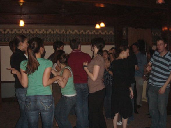 Students dancing at a party. Students dancing at a party.