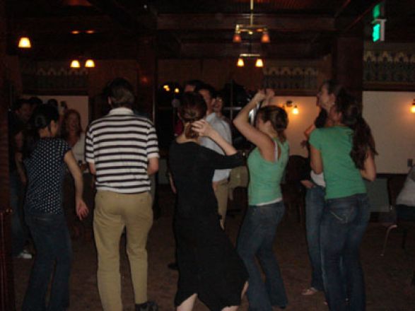 Students socializing at a party. Students socializing at a party.