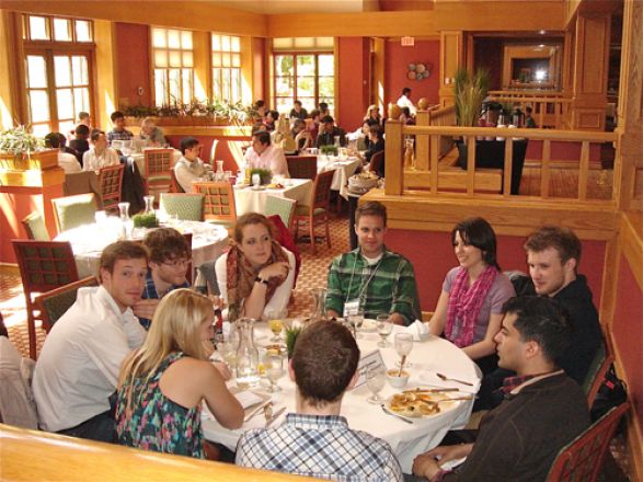 Students sitting together at a table. Students sitting together at a table.