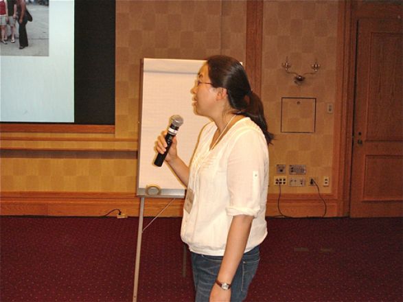 Woman presenting with a microphone. Woman presenting with a microphone.