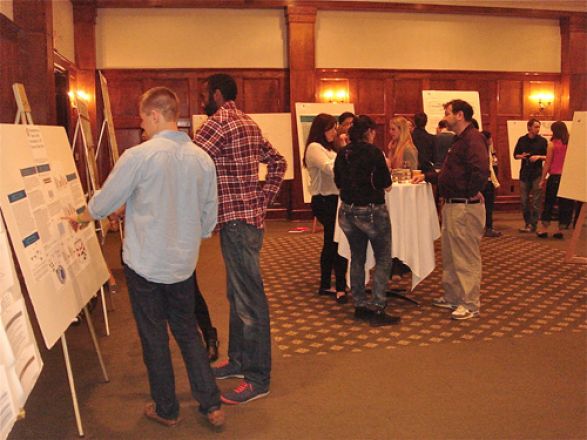 Josh Linscott and Jamie McBean standing by the poster Josh Linscott and Jamie McBean standing by the poster