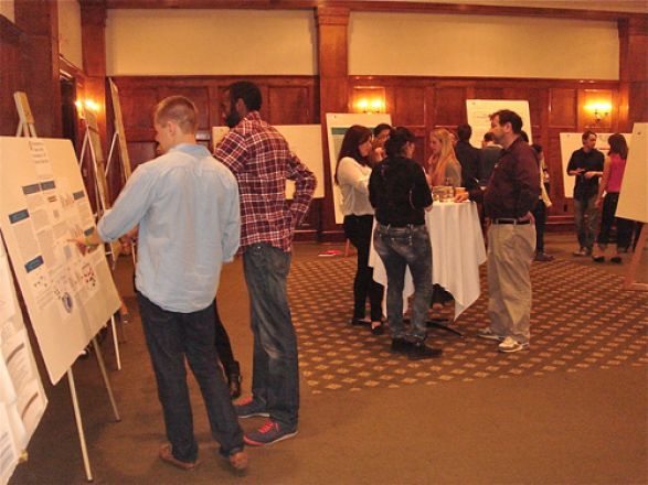 Josh Linscott and Jamie McBean standing by the poster