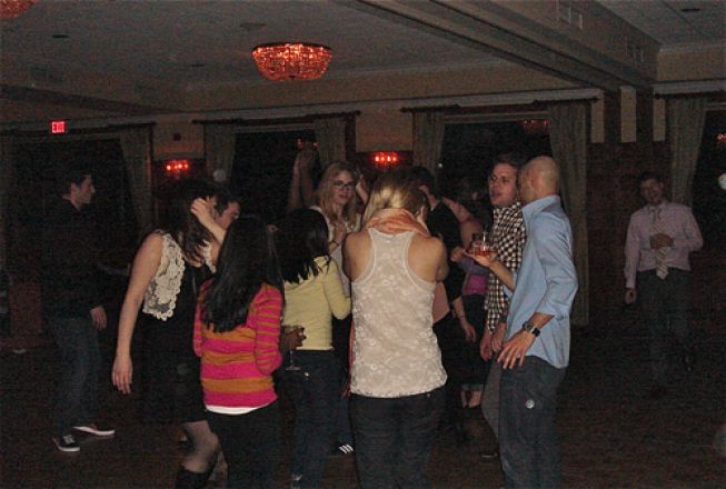 Students dancing at a party. Students dancing at a party.