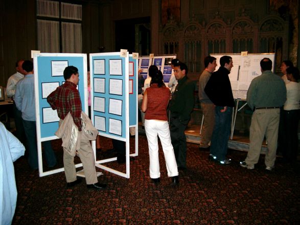 Students browsing poster boards. Students browsing poster boards.
