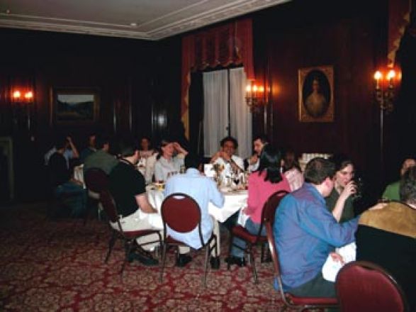 Attendees sitting at dining room table.