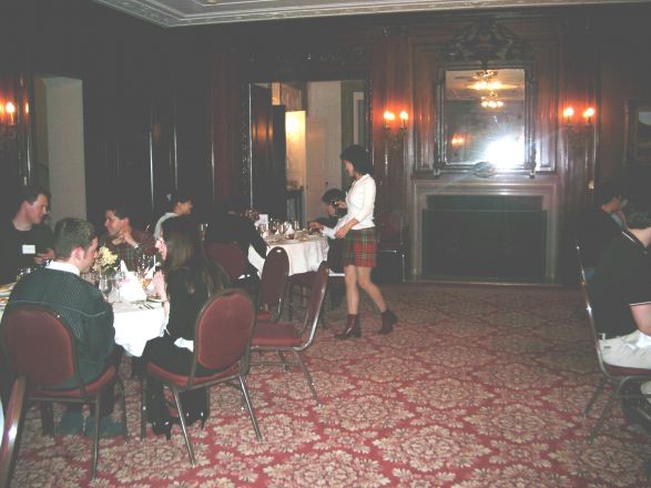 Attendees sitting at dining room table.