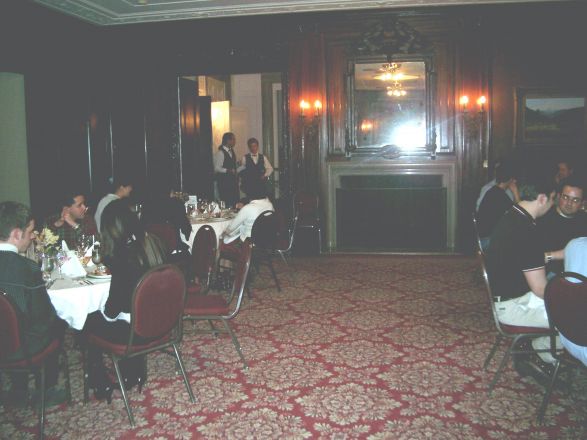 Attendees sitting at dining room table.
