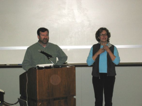 Presenters at podium. Presenters at podium.