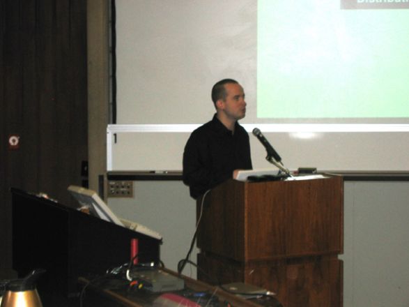 Presenter at a conference. Presenter at a conference.