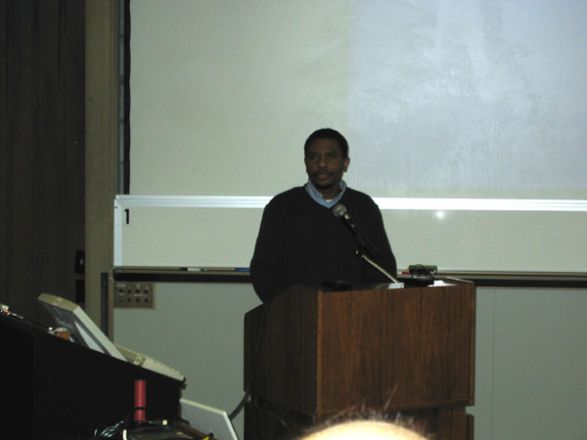 Presenter at a conference. Presenter at a conference.