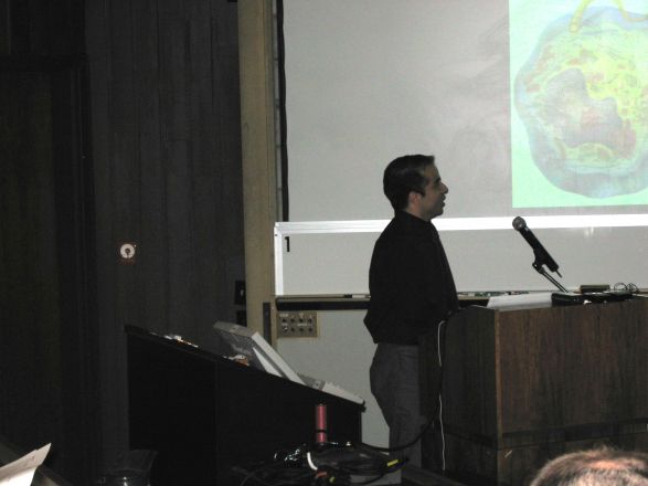 Presenter at a conference. Presenter at a conference.