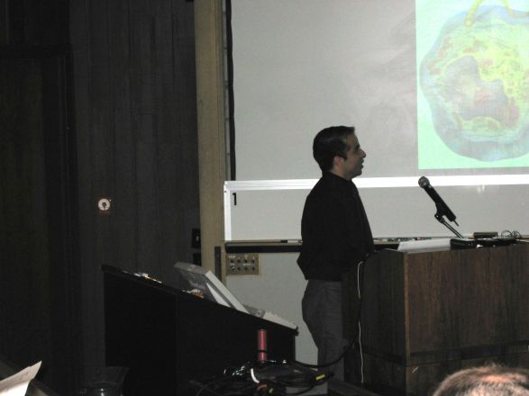 Presenter at a conference.