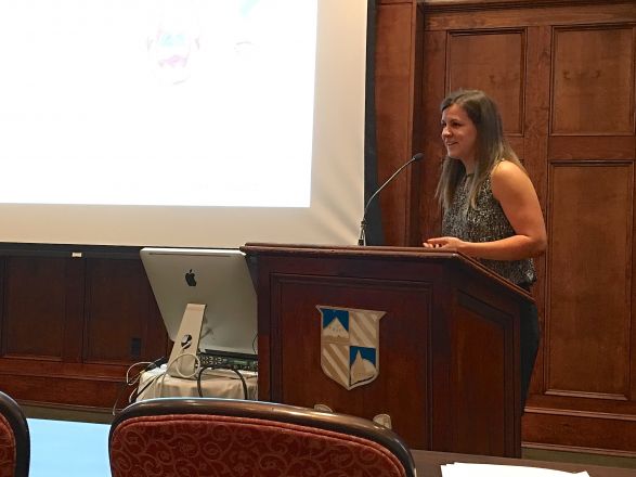 Researcher at podium during presentation.