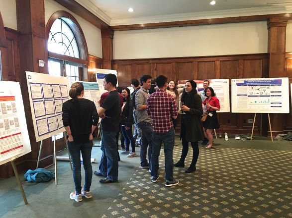 Group of students near presentation boards. Group of students near presentation boards.