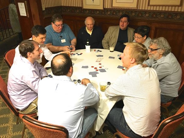 Group sitting around dining table. Group sitting around dining table.