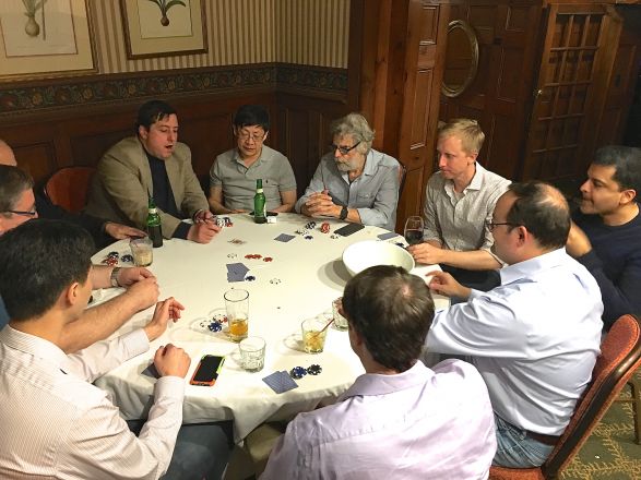 Group sitting around dining table. Group sitting around dining table.