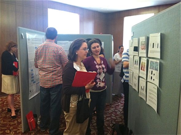 Students browse presentations at the Vigneaud Symposium.