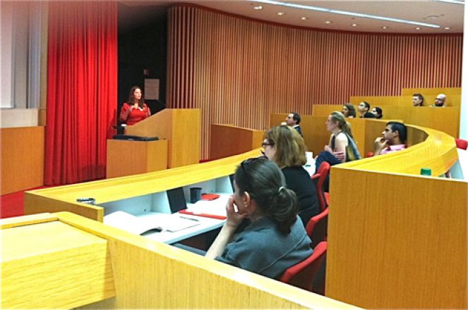 Students sit in auditorium at the Vigneaud Symposium.