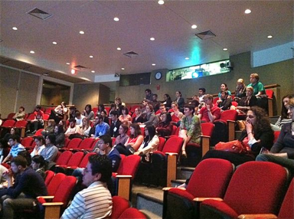 Students sit in auditorium at the Vigneaud Symposium.