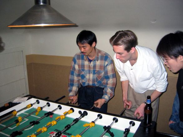 Students playing foosball.