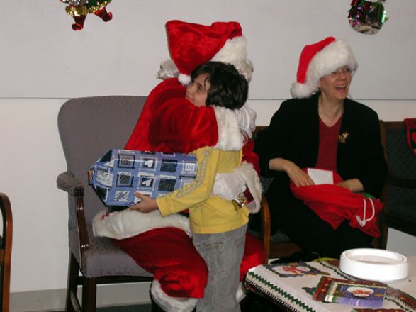 Students and faculty enjoy Holiday Party 2003.