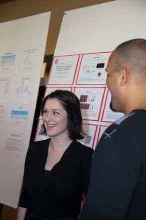 Man and woman in front of a presentation.