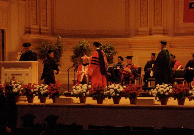 Speaker at podium during commencement.