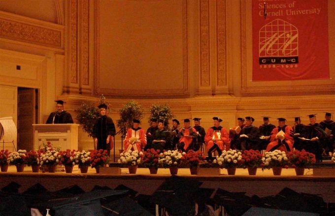 Speaker at podium during commencement.