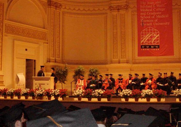 Speaker at podium during commencement.