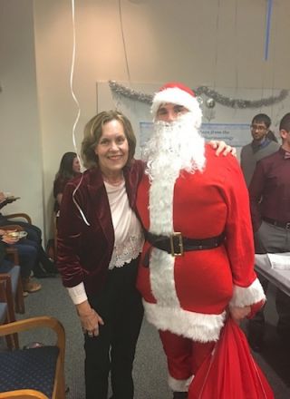 Dr. Gudas with Santa.