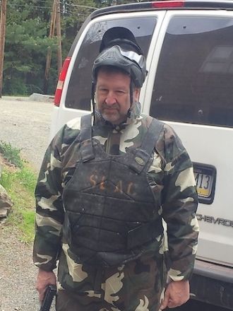 Dr. Scheinberg gearing up for paintball battle.